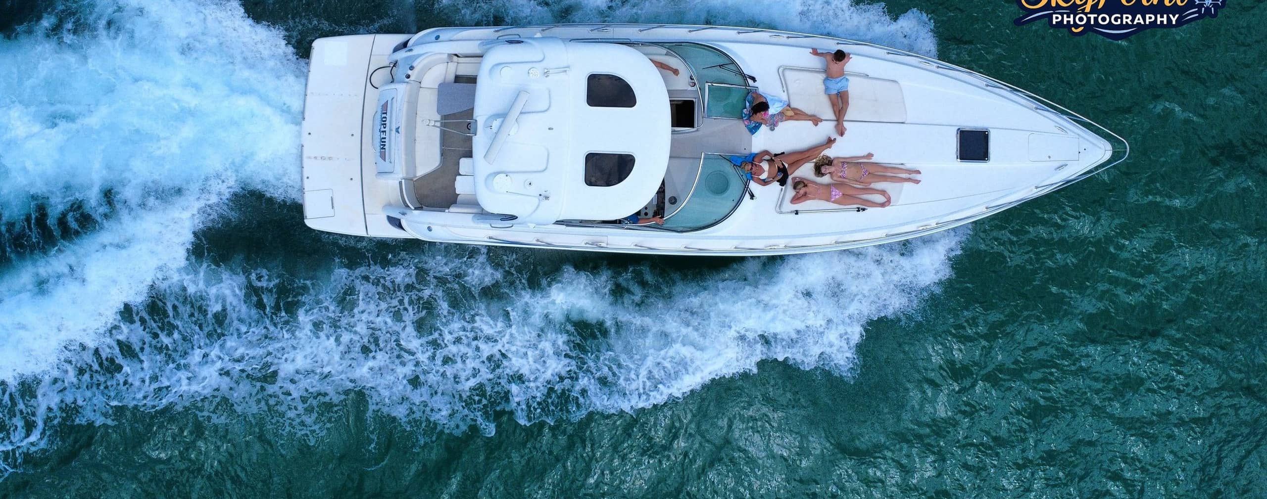 Overhead aerial of the Top Fun yacht underway