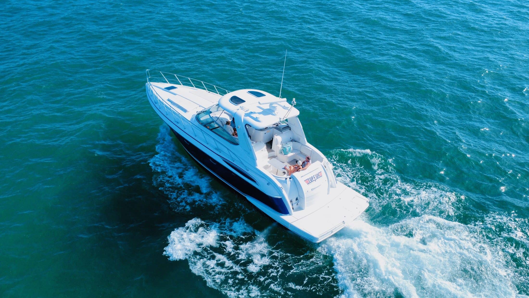Top Fun yacht carving a wake